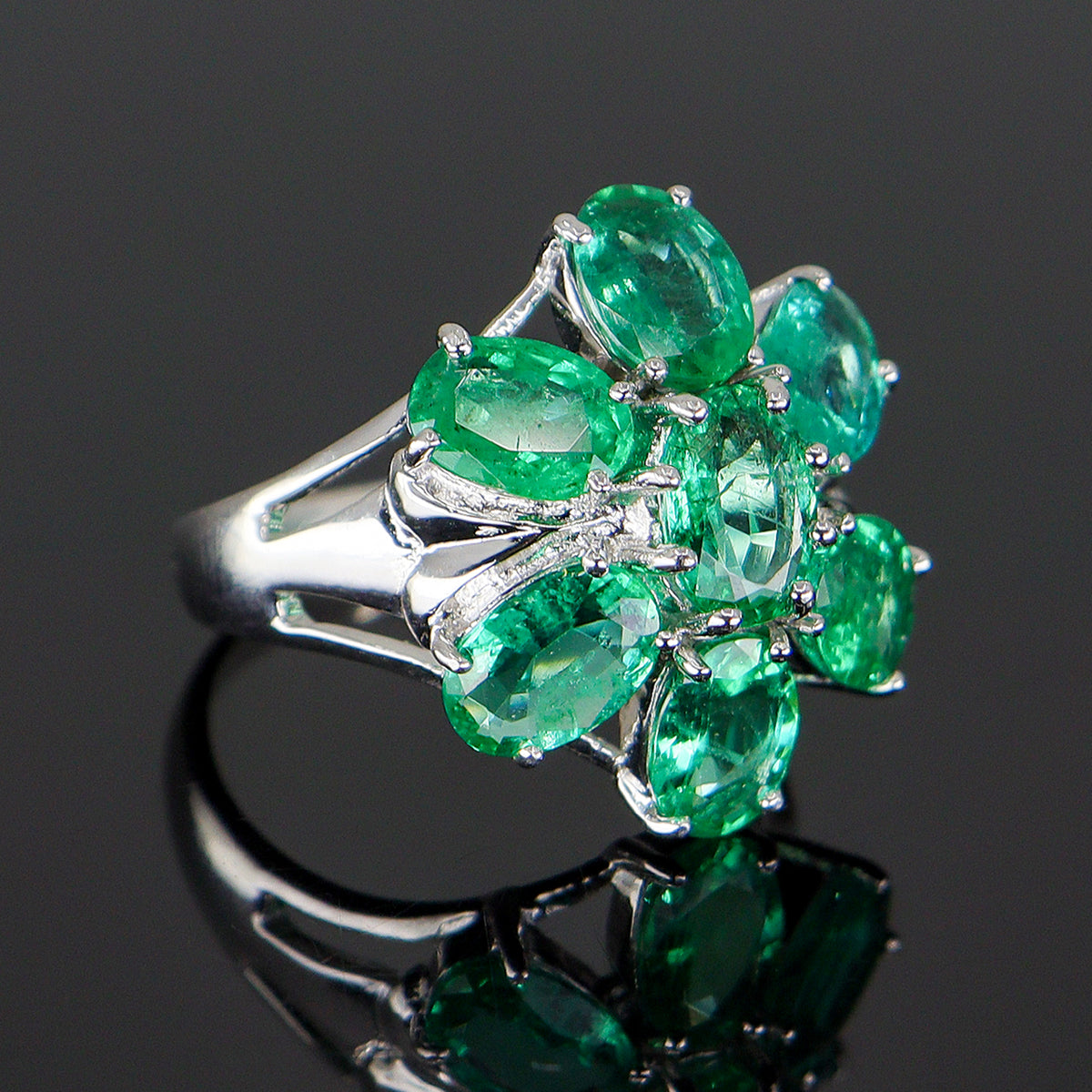Pre-Owned 9ct White Gold Oval Emerald Claw Set Seven Stone Flower Cluster Ring