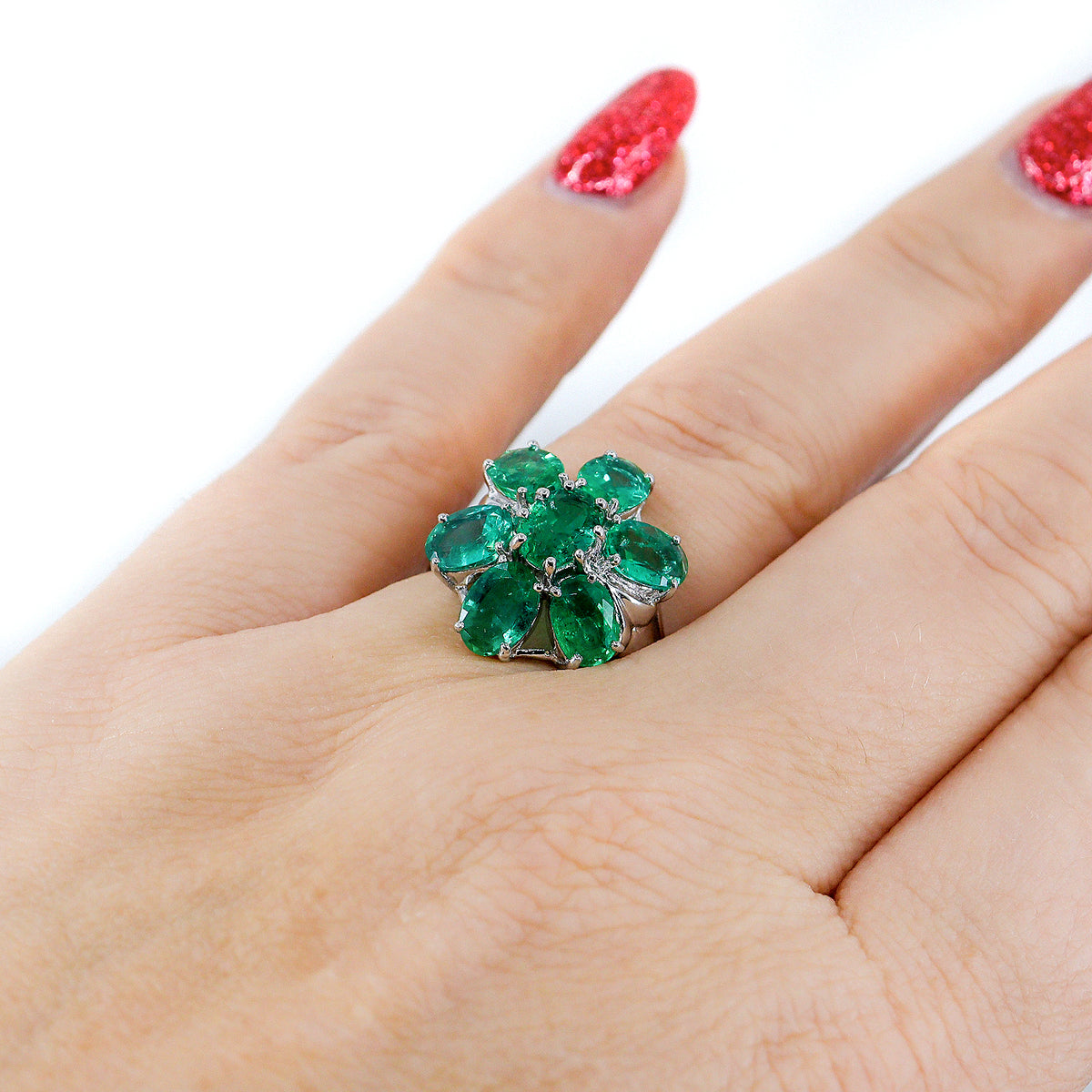 Pre-Owned 9ct White Gold Oval Emerald Claw Set Seven Stone Flower Cluster Ring