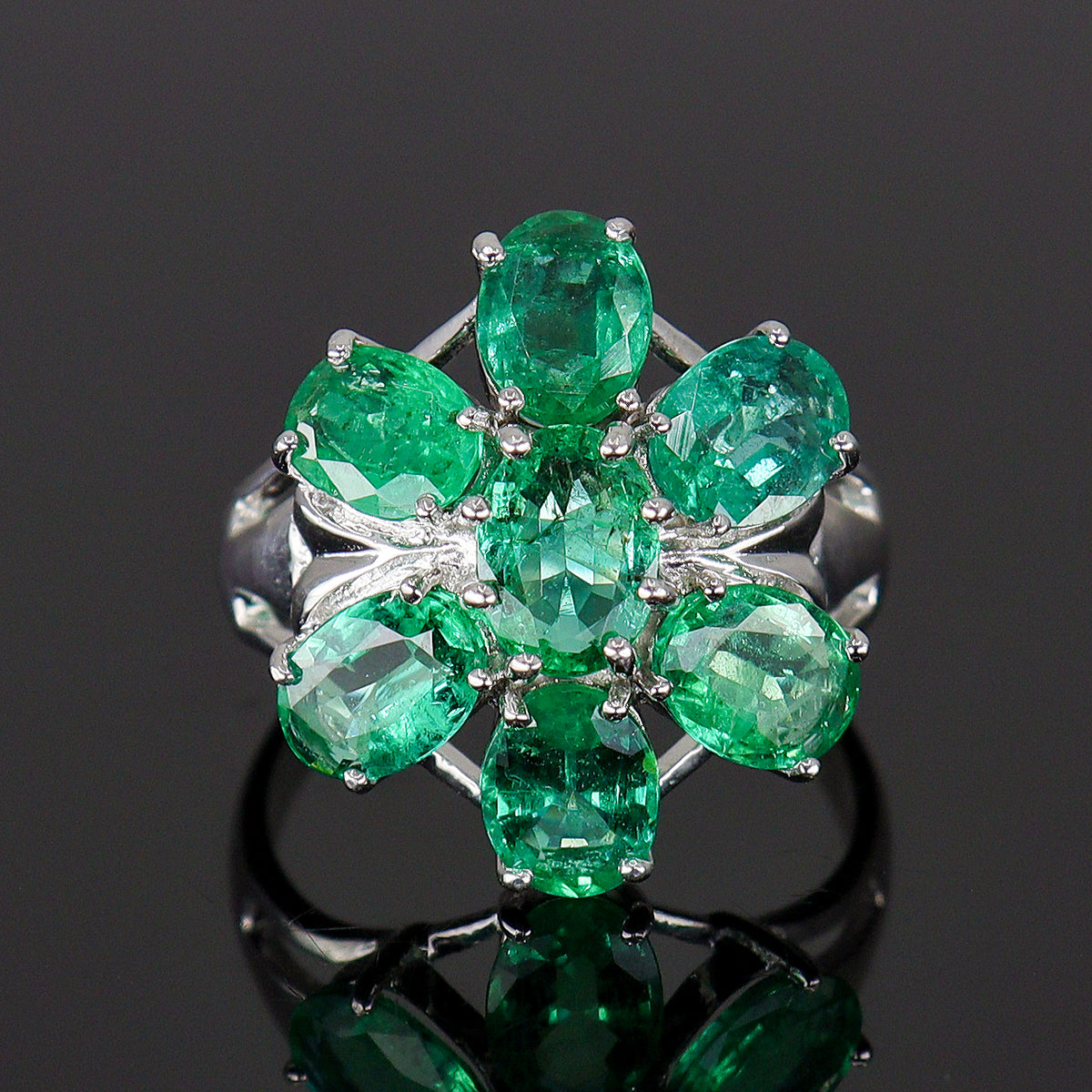 Pre-Owned 9ct White Gold Oval Emerald Claw Set Seven Stone Flower Cluster Ring