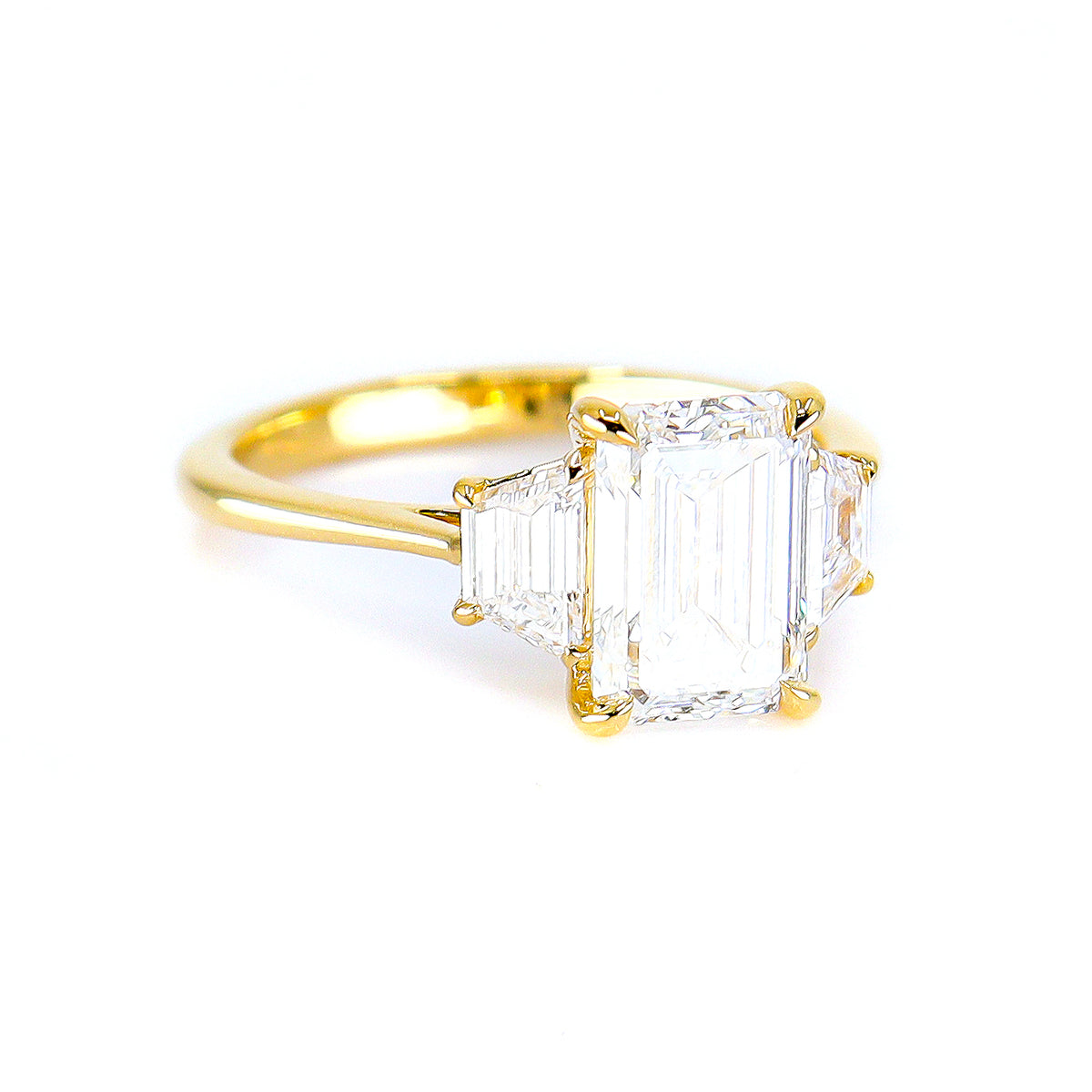 18ct Yellow Gold 2.56ct Lab Grown Emerald & Trapezoid Diamond Three Stone Ring