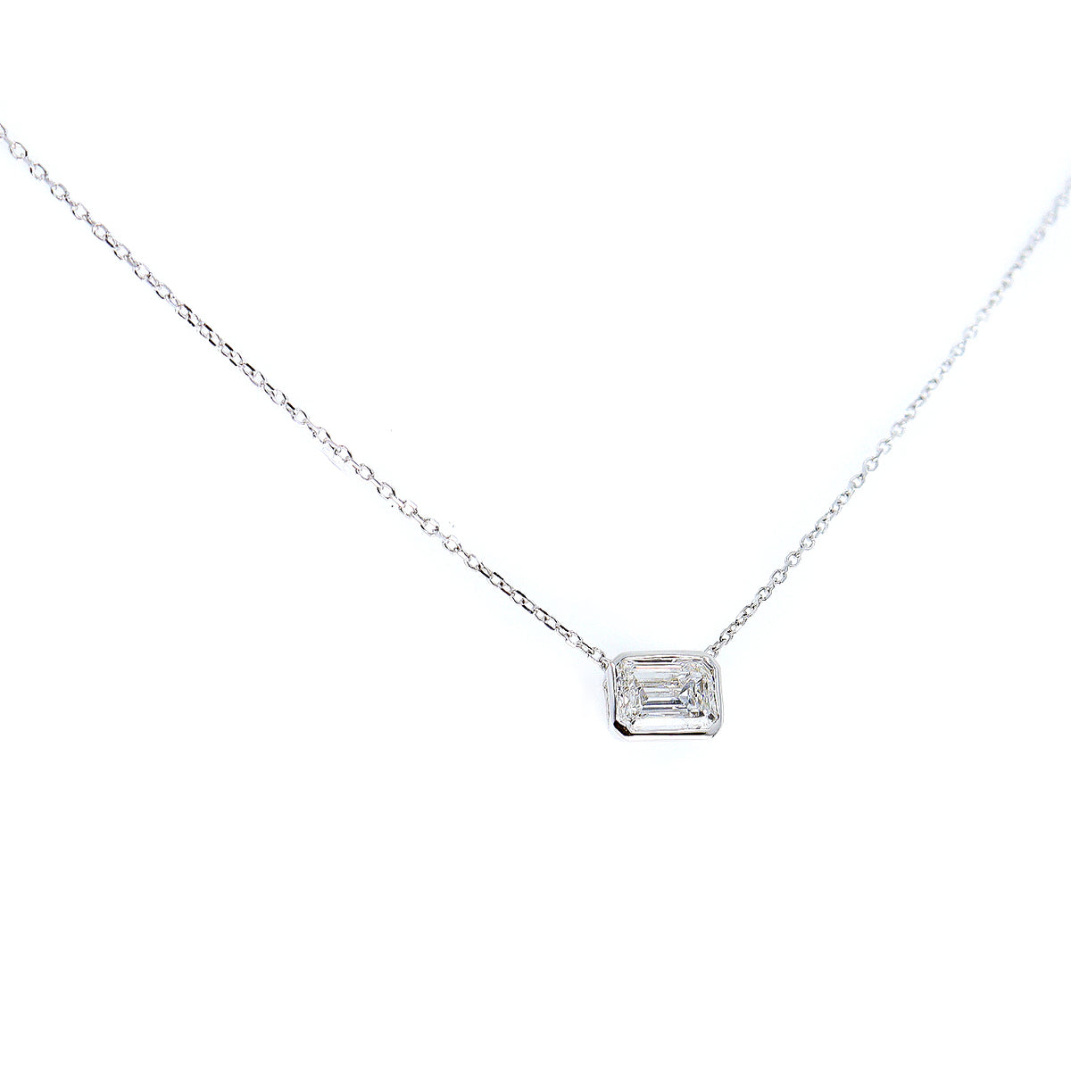 18ct White Gold Lab Grown 1.00ct Emerald Cut Solitaire Rub Set Necklace on 16-17.5'' Trace Chain