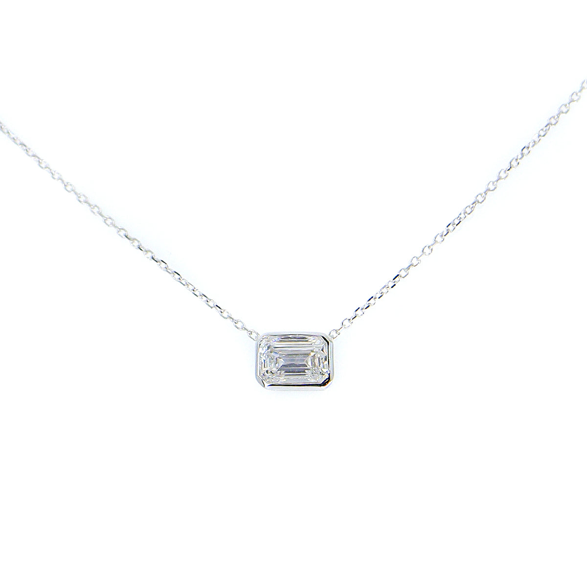18ct White Gold Lab Grown 1.00ct Emerald Cut Solitaire Rub Set Necklace on 16-17.5'' Trace Chain