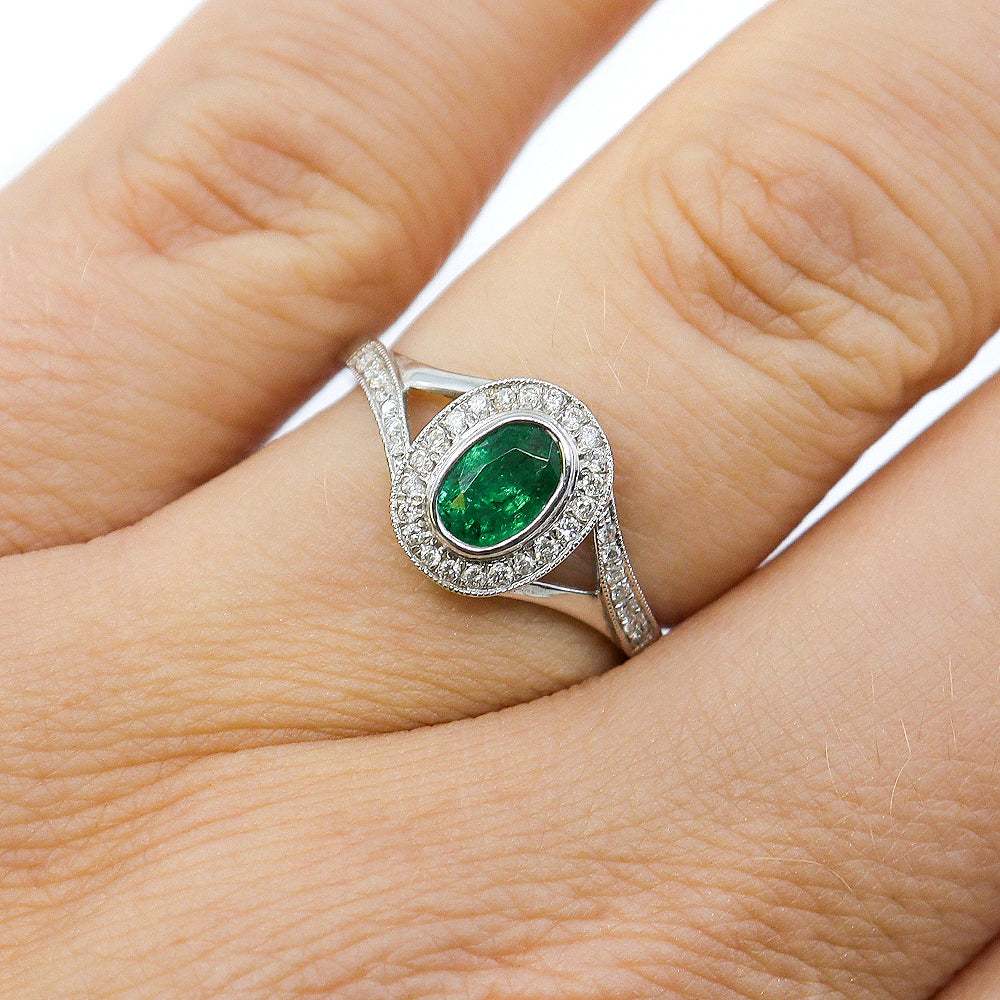 18ct White Gold 0.49ct Emerald & 0.17ct Diamond Oval Rubset Halo Ring