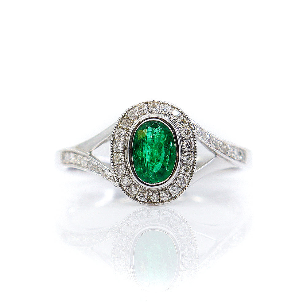 18ct White Gold 0.49ct Emerald & 0.17ct Diamond Oval Rubset Halo Ring