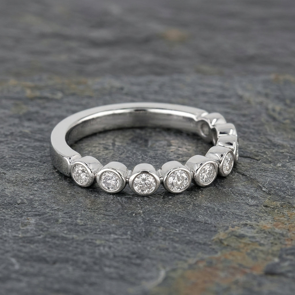 Pre-Owned Platinum Ap. 0.33ct TDW Diamond Graduated Channel Set Half Eternity Ring