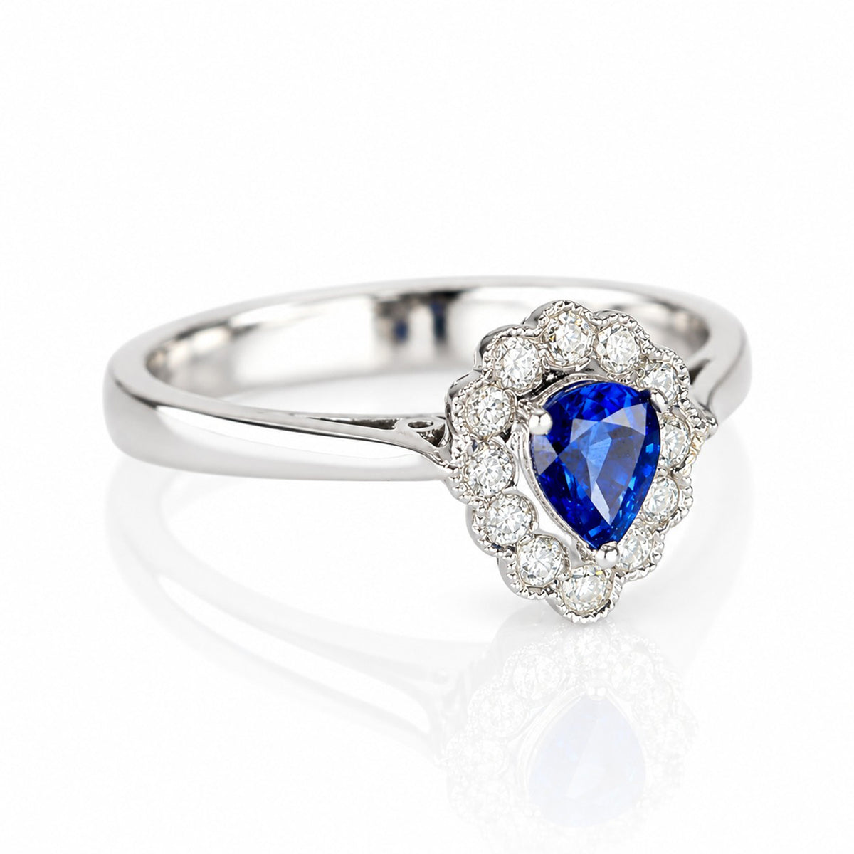 Pre-Owned 18ct White Gold Pear Cut Sapphire & Diamond Halo Cluster Ring with Millgrain Edge Detail