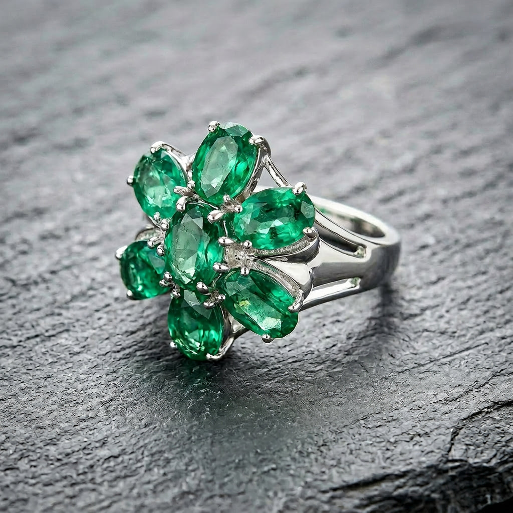 Pre-Owned 9ct White Gold Oval Emerald Claw Set Seven Stone Flower Cluster Ring