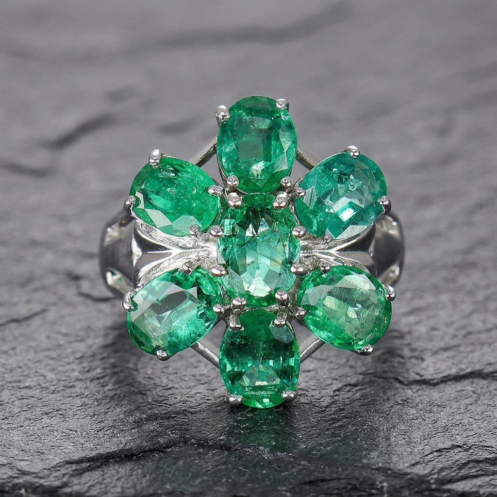 Pre-Owned 9ct White Gold Oval Emerald Claw Set Seven Stone Flower Cluster Ring