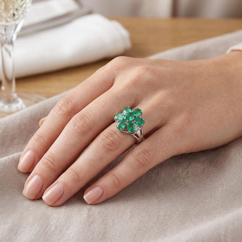 Pre-Owned 9ct White Gold Oval Emerald Claw Set Seven Stone Flower Cluster Ring